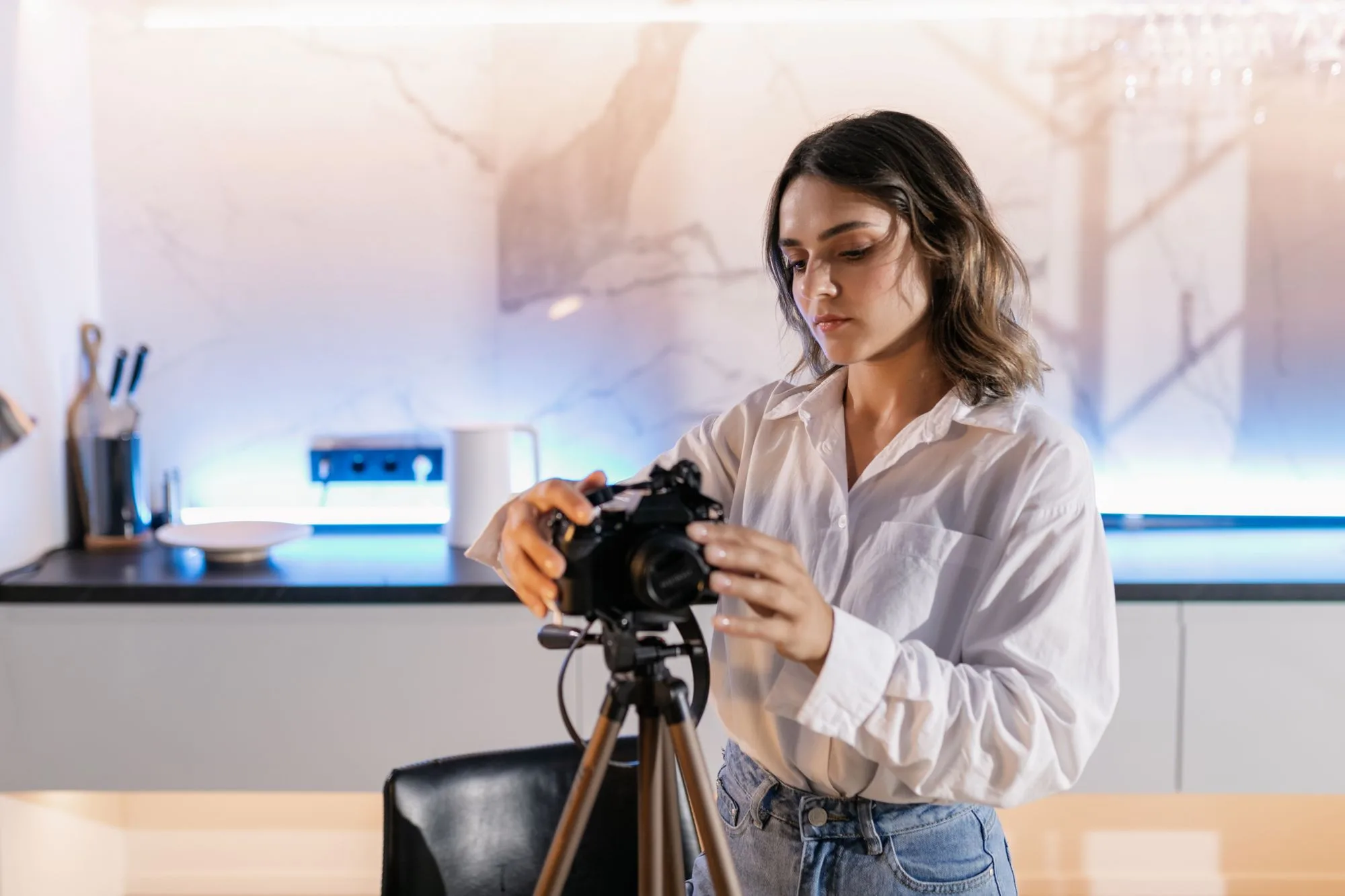 A photographer shooting the interior of a listed home